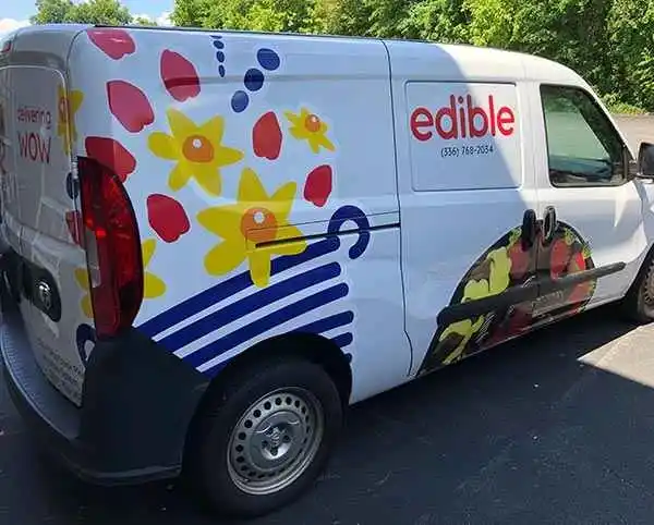 Custom vehicle wrap for Edible Arrangements delivery van in Greensboro.